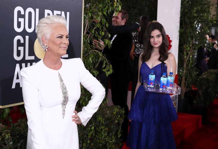 FIJI Girl photo bombs Jamie Lee Curtis at the 76th annual Golden Globe® Awards Sunday, Jan. 6, 2019 in Beverly Hills, Calif.