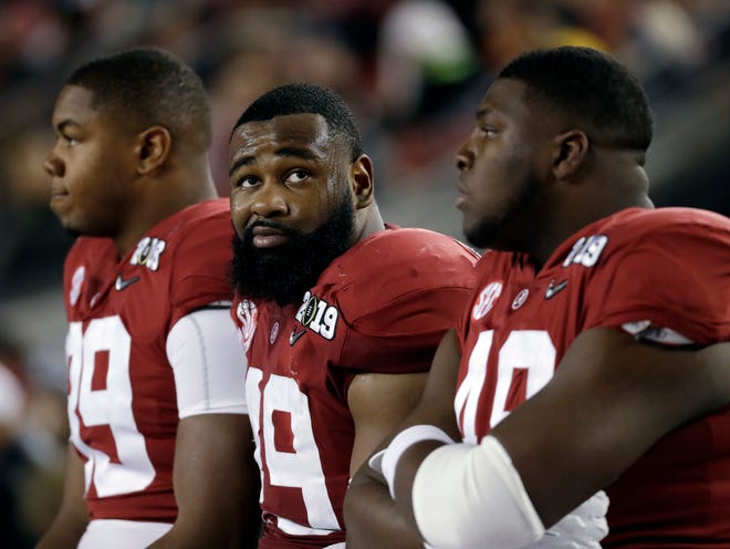 Alabama's Isaiah Buggs reacts on the bench during the second half of the NCAA college football playoff championship game against Clemson, Monday, Jan. 7, 2019, in Santa Clara, Calif. (AP Photo/Chris Carlson)