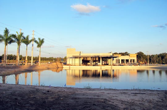 The freestanding Oak & Stone restaurant and bar will be adjacent to a water feature at the new Logan Landings retail center under construction on the southeast corner of Logan Boulevard and Immokalee Road in North Naples. 
