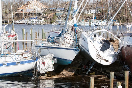 Boats lay stacked on each other in Massalina Bayou after Hurricane Michael in Panama City, Fla. on Oct. 18, 2018. 