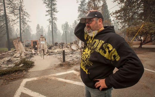 The Camp Wildfire was the costliest natural catastrophe in 2018 with $16.5 billion in losses. Paradise Unified School Board member Richard Gingery Jr. cannot believe the devastation as he looks over the remains of the continuation high school in Paradise, Calif, after the Camp Fire devastated the area on Nov. 15, 2018.