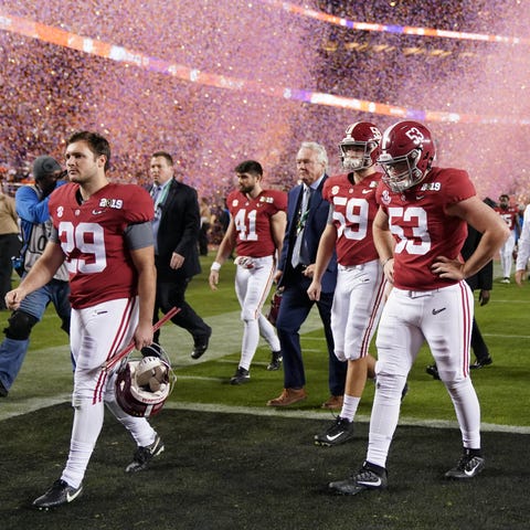 Alabama players walk off the field after the 2019...