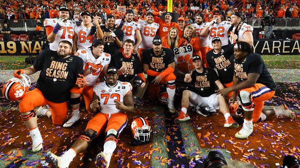 Clemson Tigers players pose for a photo after...