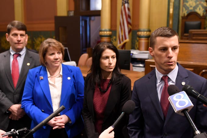 Rep. David LaGrand, left, House Democratic Leader Christine Greig, Attorney General Dana Nessel, and House Speaker Lee Chatfield speak to the media after the opening ceremonies.