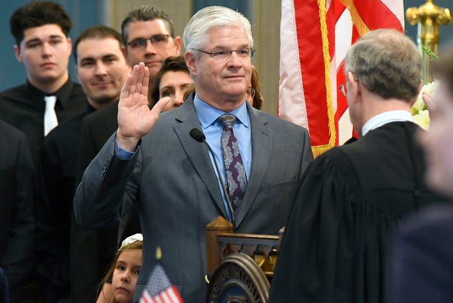 Sen. Mike Shirkey, R-Clark Lake,  is sworn in by Chief Justice Stephen Markman.
