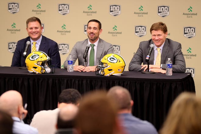 New Green Bay Packers head coach Matt LaFleur, center,  is introduced during a press conference in the Lambeau Field media auditorium with general manager Brian Gutekunst, left, and team president Mark Murphy Wednesday, January 9, 2019 in Green Bay, Wis.
