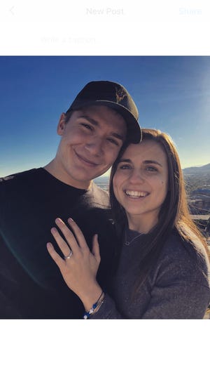 ASU hockey captain Brinson Pasichnuk and volleyball libero Halle Johnson became engaged Jan. 3 on the top of A Mountain.