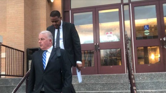 (front) Thomas Vallely, Dan Jones' lawyer, and Jones walk out of the New Rochelle City Court.