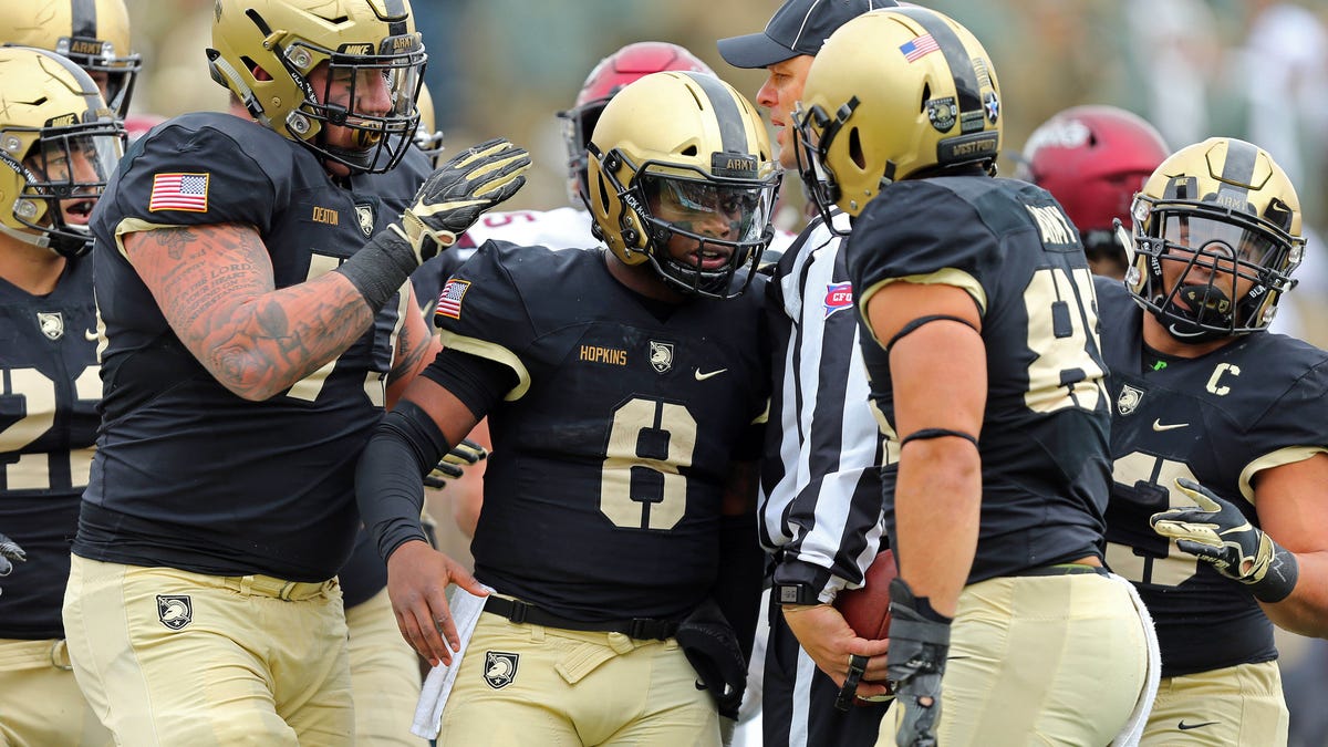 Army quarterback Kelvin Hopkins Jr. (8) and his teammates celebrates a touchdown against Colgate during their game in 2018.