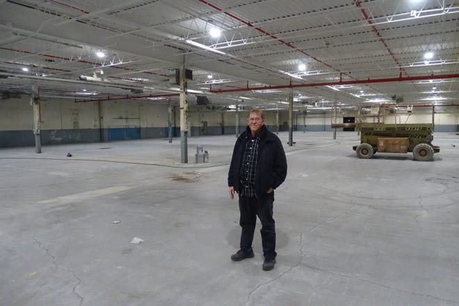 Danny Burns, site manager of Ohio Polytech, the former Swan plant, stands in an area of the building the company is renovating.