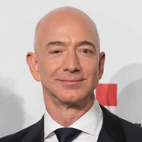 Amazon CEO Jeff Bezos and wife MacKenzie Bezos...