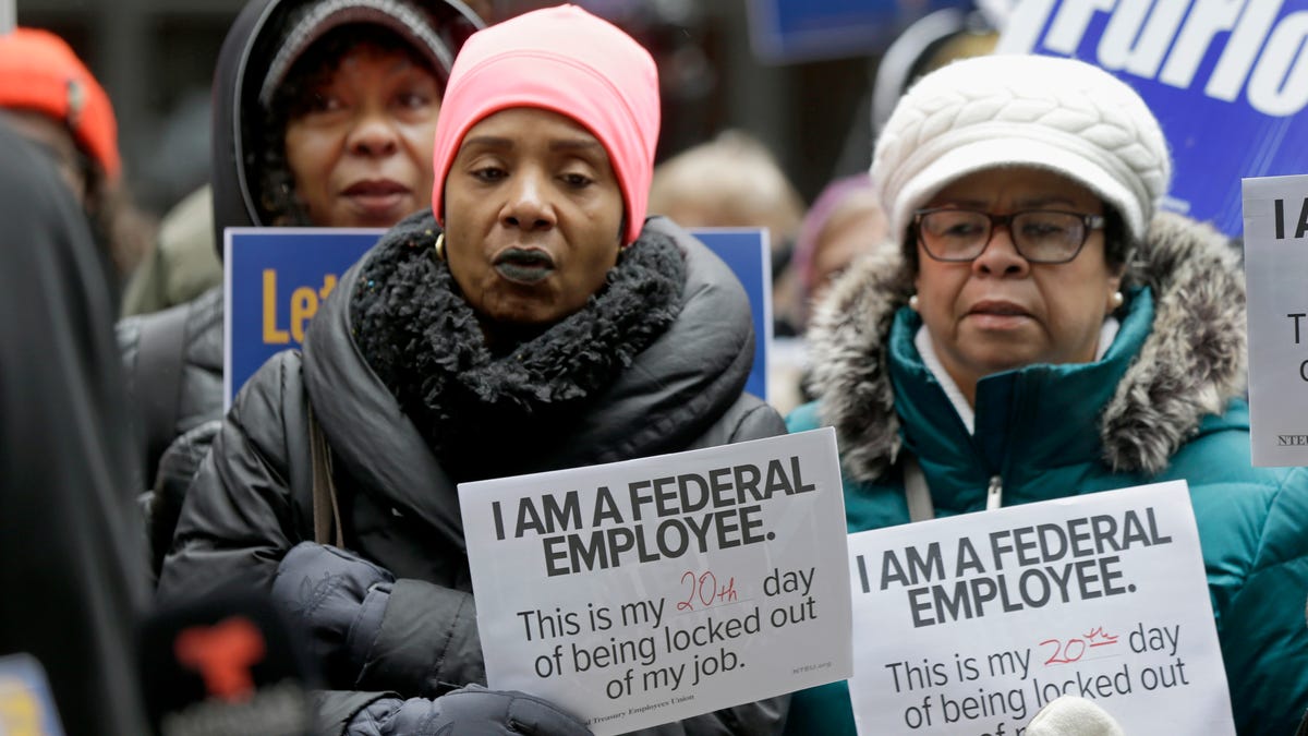 Government workers rally against the partial government shutdown at Federal Plaza,  in Chicago, Jan. 10, 2019.