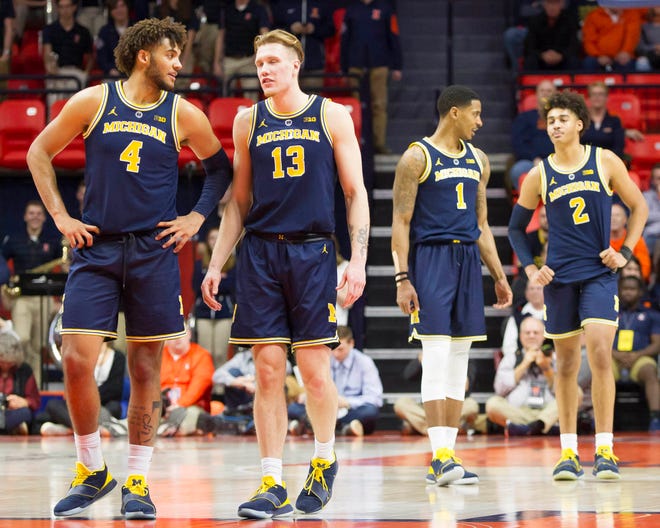 (From left) Michigan forwards Isaiah Livers and Ignas Brazdeikis and guards Charles Matthews and Jordan Poole take the court following a timeout  during the second half of U-M's 79-69 win on Thursday, Jan. 10, 2019, in Champaign, Ill.