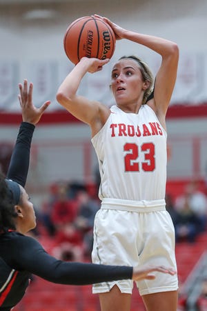 North Central Panthers guard Savaya Brockington (4) tries to block a three-point shot by Center Grove Trojans guard Emma Utterback (23) in the first half of the game at Center Grove High School in Greenwood, Ind., Thursday, Jan. 10, 2019. Center Grove defeated North Central, 51-44. 