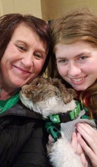 Jayme Closs poses with her aunt, Jennifer Smith, and her dog, with whom she was reunited Friday. The photo was posted on the Healing for Jayme Closs Facebook page.