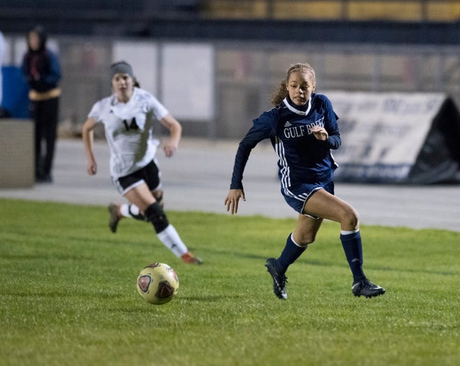 Aiyannah Robinson (14) races to the ball during the Niceville vs Gulf Breeze soccer game at Gulf Breeze High School on Thursday, January 10, 2019.