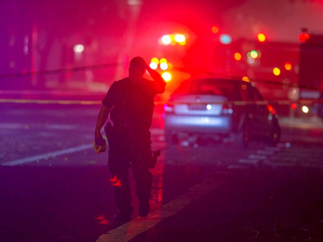 Davis Police closed the area near 5th and C streets in Davis, Calif., after a police officer was shot on Thursday, Jan. 10, 2019. A Davis police officer was shot Thursday night while responding to a traffic accident, and authorities cordoned off parts of downtown while searching for a suspect.