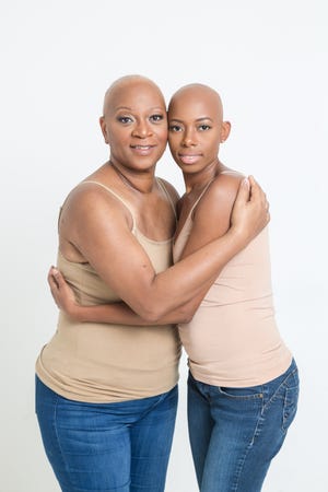Pam Moore with her daughter Mikaya Warren, after treatment for breast cancer.