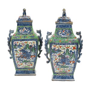 A pair of clobbered Chinese urns decorated with blue-and-white pictures of houses and a river were overpainted with colored flowers, leaves and a cracked ice design. The pair sold for $5,750.