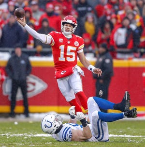 Indianapolis Colts defensive end Margus Hunt (92) can't get to Kansas City Chiefs quarterback Patrick Mahomes (15) during a pass at Arrowhead Stadium in Kansas City, Mo., on Saturday, Jan. 12, 2019. 