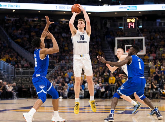 Marquette'd Sam Hauser shoots during the first half against Seton Hall on Saturday.