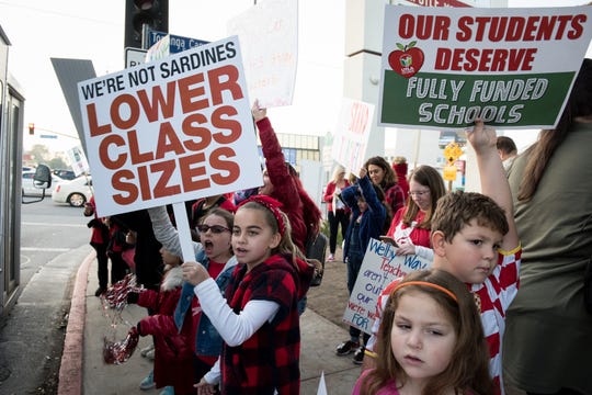 Students show support for teachers at a rally in Woodland Hills, Calif. Unless LAUSD and United Teachers Los Angeles, which represents 31,000 educators in Southern California, can come to an agreement on a contract, teachers across the district will strike on Monday.