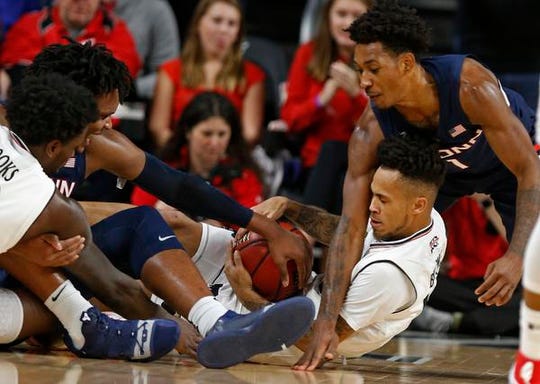 Cincinnati Bearcats guard Cane Broome, center, had a flurry of points at the end of the game against Tulsa last time around to help UC to a 70-65 overtime win.
