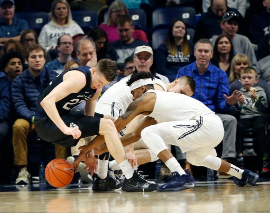 Jan 13, 2019; Cincinnati, OH, USA; Xavier Musketeers guard Paul Scruggs (1) goes for the ball during the first half against the Butler Bulldogs forward Sean McDermott (22) at the Cintas Center.