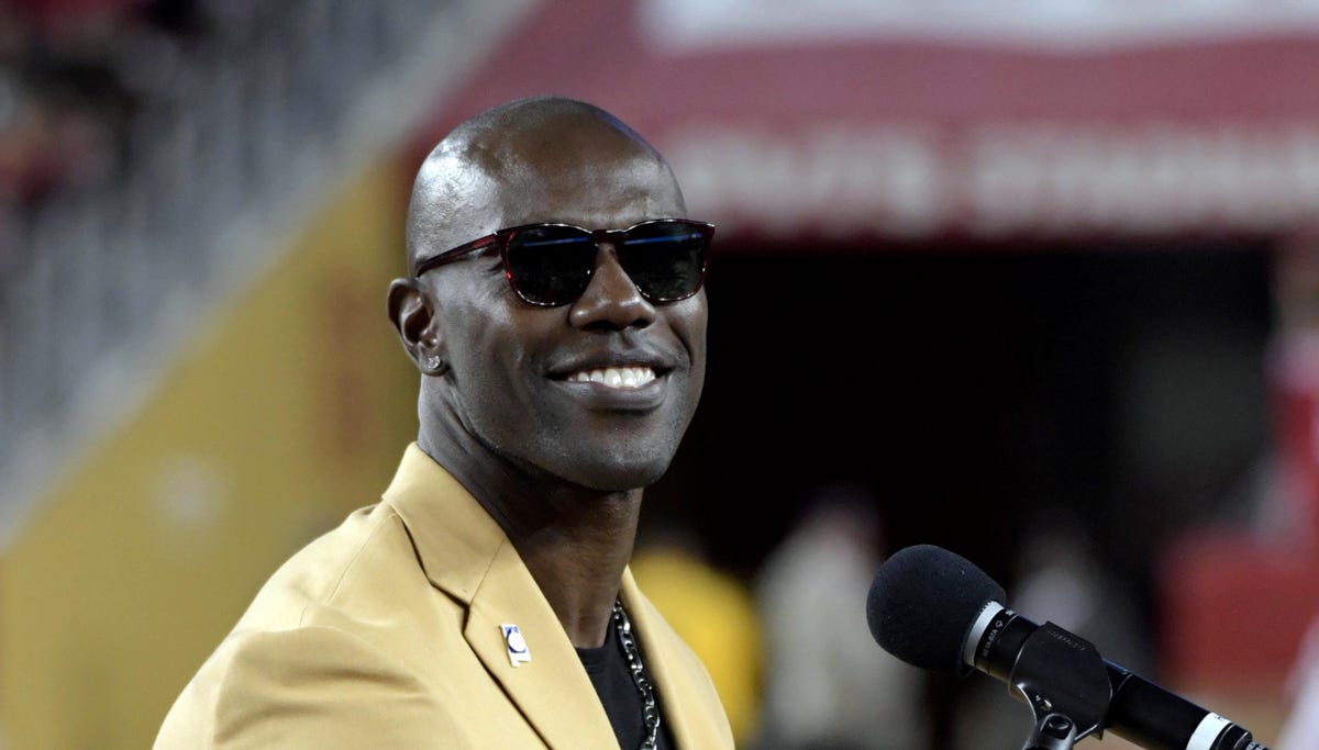 Terrell Owens speaks while being honored at halftime of a San Francisco 49ers game in November.