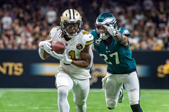 New Orleans Saints running back Alvin Kamara (41) runs the ball against Philadelphia Eagles strong safety Malcolm Jenkins (27) at the Mercedes-Benz Superdome.