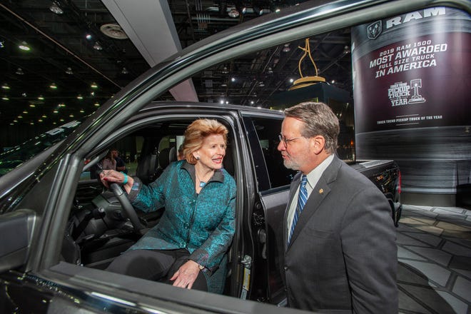 U.S. Sens. Debbie Stabenow and Gary Peters check out the Motor Trend 2019 Truck of the Year, the Ram 1500 Limited, while touring the show floor at the North American International Auto Show in Detroit on Monday