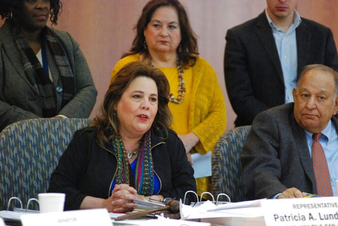 New Mexico lawmakers including Rep. Patria Lundstrom, left, D-Gallup, announces a proposal for an 11 percent increase in general fund spending for the coming fiscal year amid a surge in state government income on Monday, Jan. 14, 2019 in Santa Fe, N.M. Most of the new spending would go toward efforts to improve public education as the judiciary threatens to intervene to ensure adequate resources for struggling schools. Lundstrom is chairwoman of the legislature's lead budget writing committee.