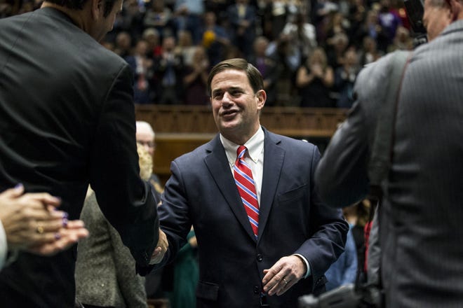 Gov. Doug Ducey enters the House Chambers during the State of the State on Jan. 14, 2019, at the Arizona House of Representatives Chambers in Phoenix.