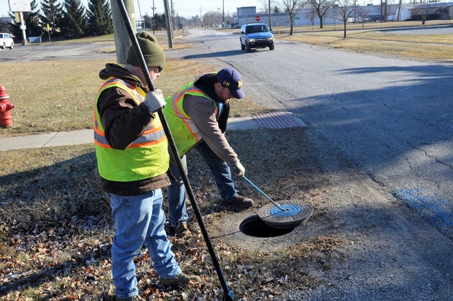 From left, Marysville Department of Public Works utilities Randy Smith and Jake Godlewski conduct maintenance checks of the city's water line valves on Jan. 14, 2018.