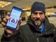 TSA agent Anthony Morselli of Georgia, VT, shows his GoFundMe post on Facebook before starting his shift at Burlington International Airport on Friday, Jan. 11, 2019. Morselli and his wife, both TSA agents, didn't get paid along with approximately 800,000 other federal workers and, to try to make ends meet, started the GoFundMe site to try to pay the bills as the government shutdown entered it's 21st day. (Via OlyDrop)