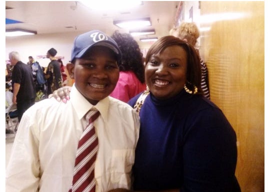 Meshell Baylor (right) poses for a photo with her son Justin Baylor (left).