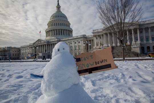 A snowman with a message is seen at the U.S. Capitol in Washington on the 24th day of a partial government shutdown,  Jan. 14, 2019.