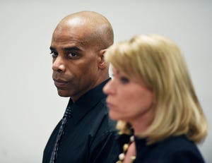 Detroit Police Cpl. Dewayne Jones stands with his attorney Pamella Szydlak as they listens to Judge Cylenthia LaToye Miller during his hearing.