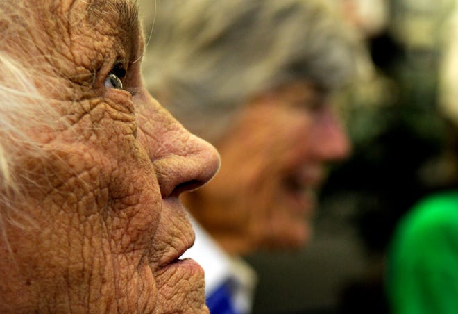 In this July 15, 2010, file photo, Millicent Peterson Young of Colorado Springs, Colo., a member of the Women Airforce Service Pilots, or WASPs, during World War II, looks on during an event at the Bird Aviation Museum and Invention Center in Sagle, Idaho. Young died Saturday, Jan. 12, 2019, at the age of 96. Young and other WASPs flew bombers and other warplanes in the United States during the war to free up male pilots for combat service overseas.