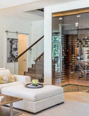 This custom wine room can hold more than 300 bottles.