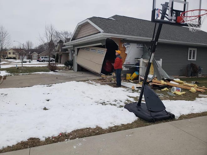 A garage on the 300 block of Foster Street is damaged Saturday morning. Police say a drunken driver hit two homes early Saturday morning.