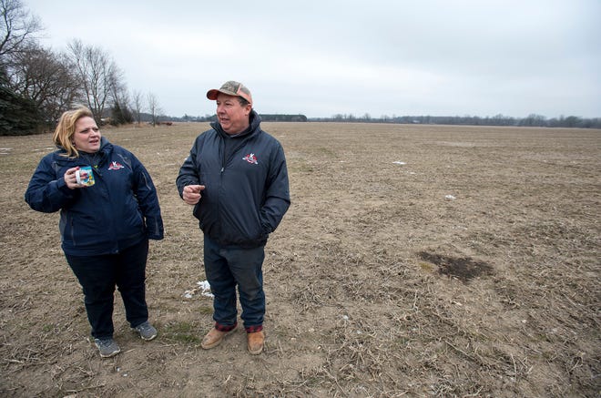 Michael and his wife Amy Pratt stand in one of their winter wheat fields Tuesday, Jan. 15, 2019 on their farm in Allenton. Offices for the USDA Farm Service Agency were closed at the beginning of the year due to the government shutdown, which put a strain on local farmers.