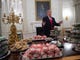 President Donald Trump speaks alongside fast food he purchased for a ceremony honoring the 2018 College Football Playoff National Champion Clemson Tigers in the State Dining Room of the White House in on  Jan. 14, 2019.  Trump says the White House chefs are furloughed due to the partial government shutdown.