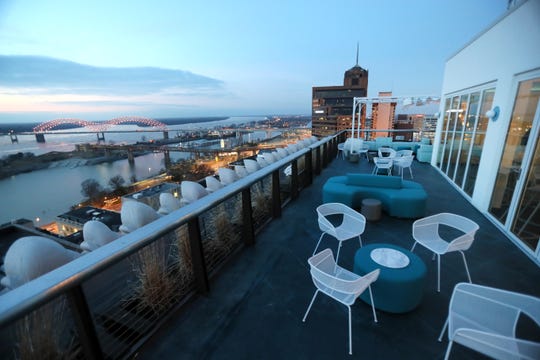 Who Hotel Memphis rooftop bar with city views and cocktail setup