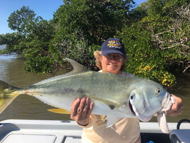 Becky Beatty with a 15-pound jack Fishing with a banjo minnow.