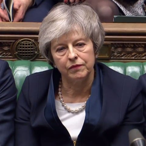 Britain's Prime Minister Theresa May reacts in...