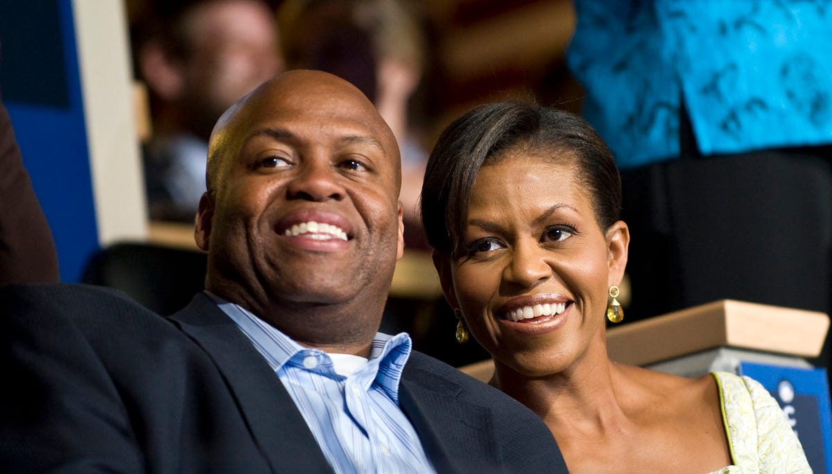 Michelle Obama and her brother Craig Robinson attend the Democratic National Convention in Denver. (Photo by Rick Friedman/Corbis via Getty Images)