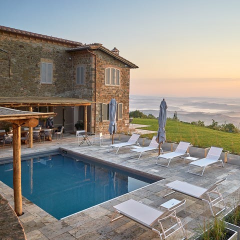 This villa in Val d'Orcia has four bedrooms and...