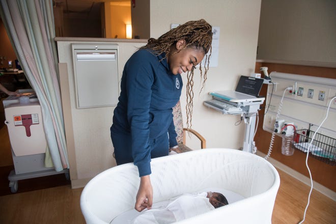 Tyra Wilson of Sicklerville checks on her 19-day-old baby, Princess Jackson, during a demonstration of the new SNOO Smart Sleeper at Jefferson Washington Township Hospital in Sewell, N.J. The bed is designed to safely soothe babies to sleep. The hospital uses the bassinets for babies born with neonatal abstinence syndrome, as well as some premature and colicky infants. (Born premature and otherwise healthy, the sleeping Princess briefly modeled the SNOO for demonstration purposes only.)