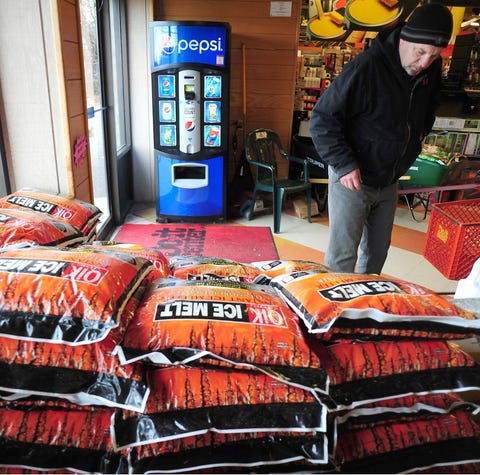 Customers purchase rock salt and ice melt...